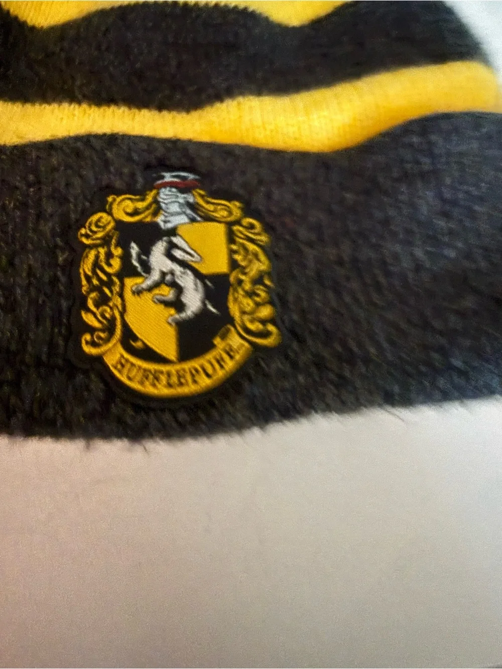 Kids Yellow & Black Striped Knit Pom Beanie with Harry Potter Hufflepuff Crest